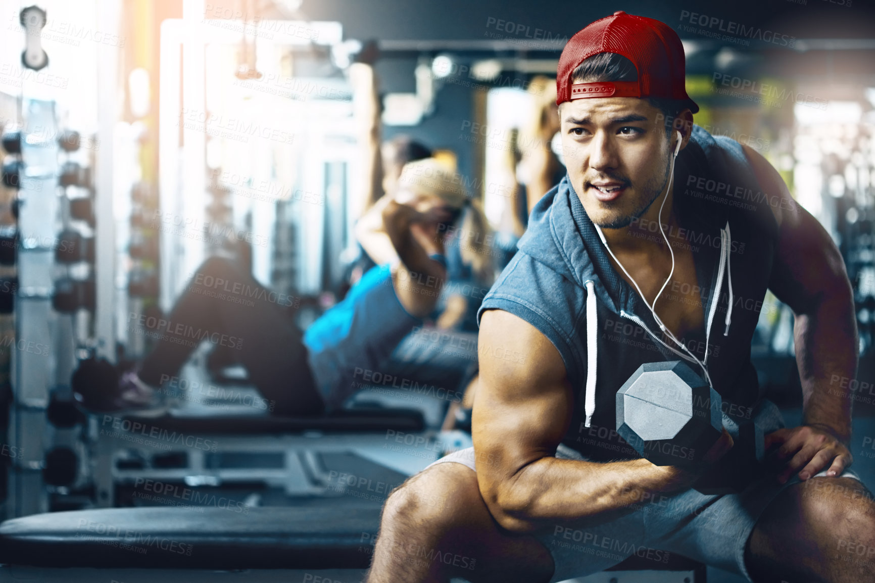 Buy stock photo Shot of a man doing weight training at the gym