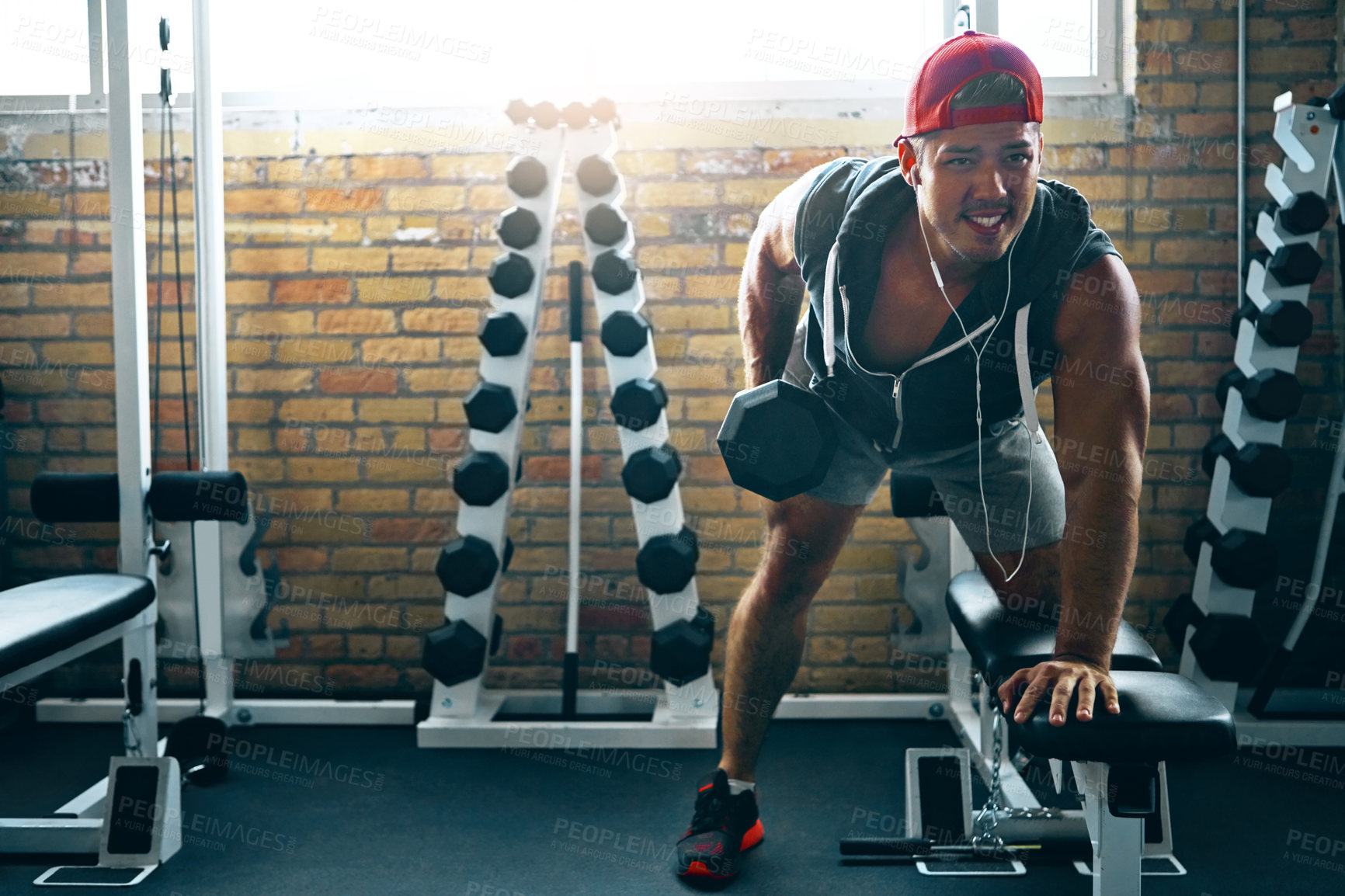 Buy stock photo Shot of a man doing weight training at the gym