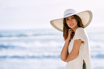 Buy stock photo Cropped shot of a beautiful young woman posing on the beach