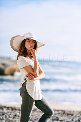 Buy stock photo Confident, smile and portrait of woman at beach for summer vacation, holiday and adventure in Bali. Outdoor, tourist and relax by ocean on coast with hat for weekend trip, happiness and island travel