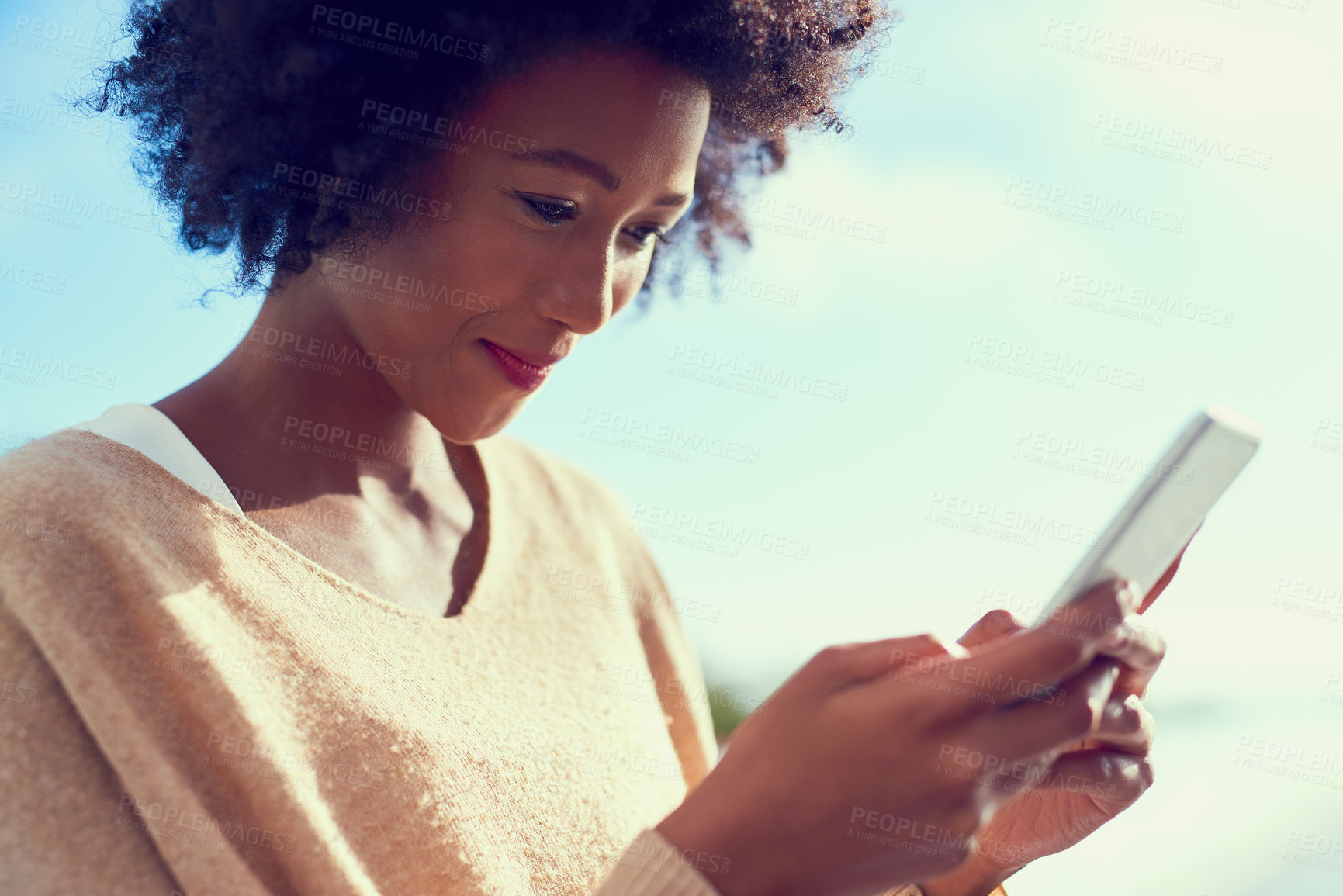 Buy stock photo African, woman and happy with smartphone for contact, communication and message on social media. Female person, mobile and smile at meme or funny joke for connection, networking and texting friends