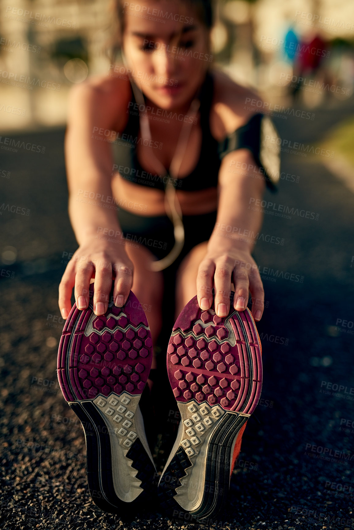 Buy stock photo Girl, runner and stretching legs on ground, outdoor and warm up for exercise or fitness training. Female person, earphones and athlete for cardio preparation, muscle flexibility and music for workout