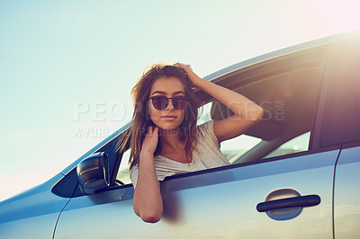 Buy stock photo Portrait of a young woman leaning out the window of her car