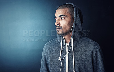 Buy stock photo Fitness, thinking and man in gym with hoodie, earphones and mockup space at studio workout. Health, wellness and athlete with music app for exercise, inspiration and confidence on dark background