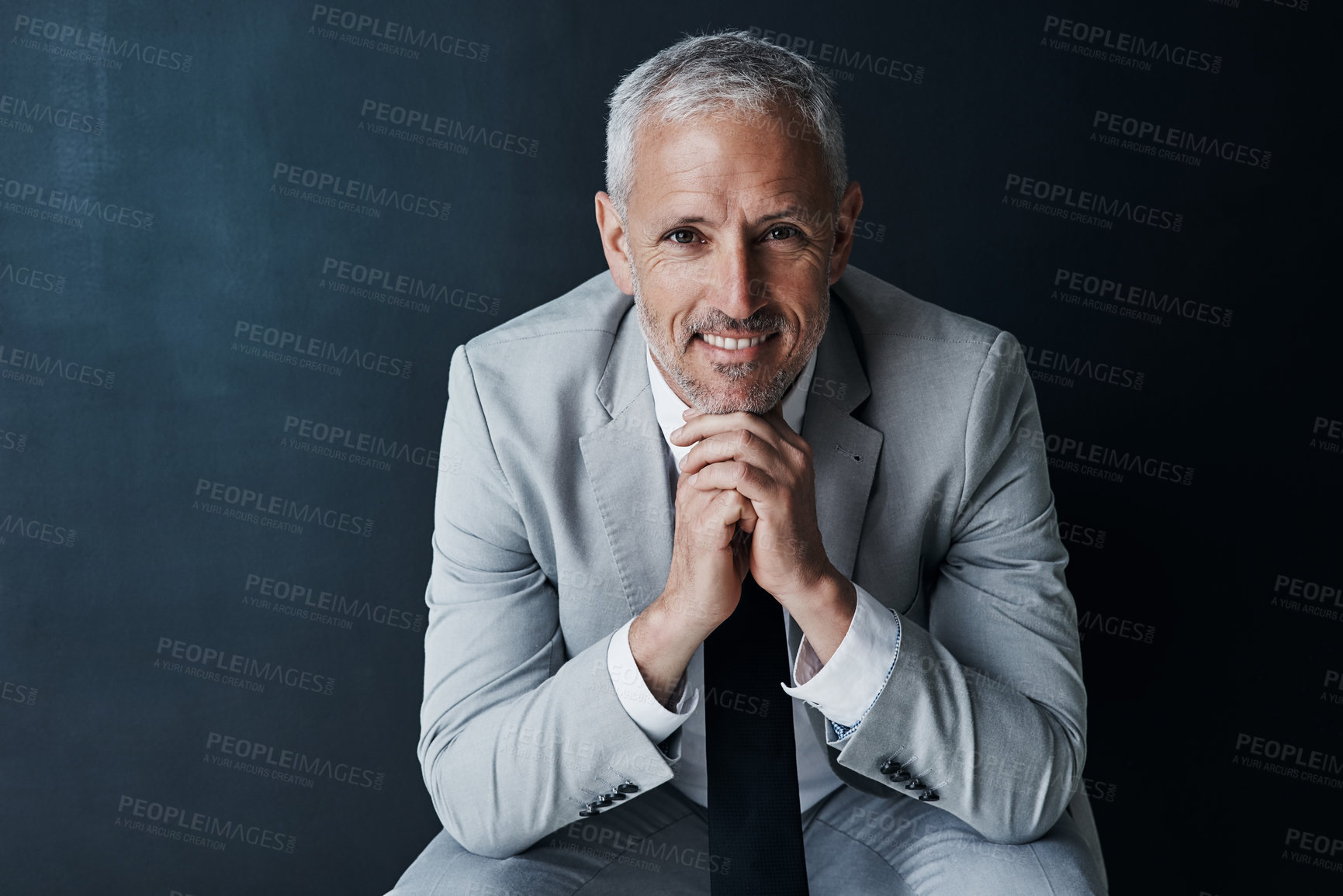 Buy stock photo Happy portrait of senior attorney sitting with confidence, mockup space and dark background in studio. Pride, professional ceo and executive lawyer man with smile, mature businessman or law firm boss