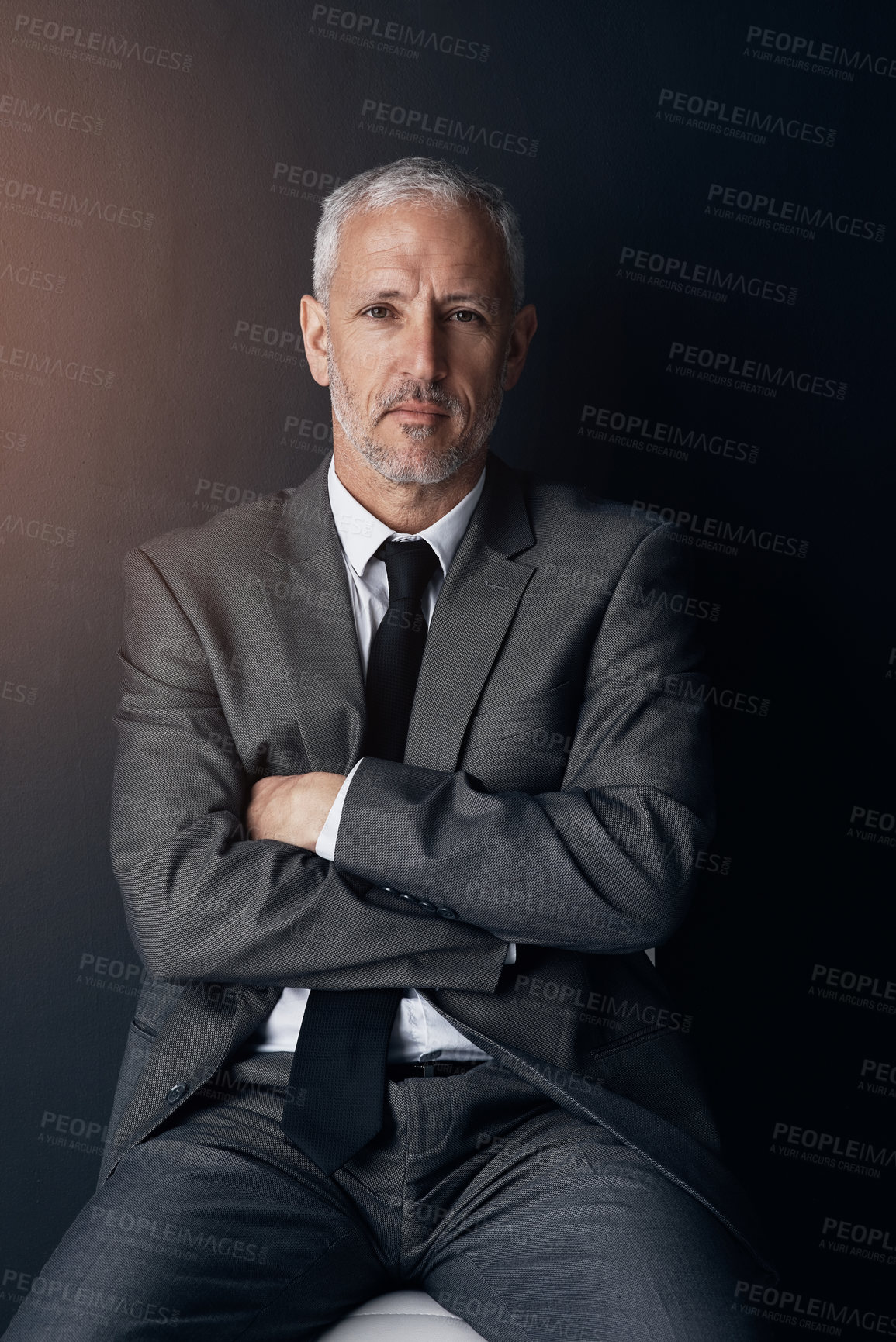 Buy stock photo Portrait, chair and serious businessman with confidence, lawyer or attorney with on dark background in studio. Boss, ceo and professional business owner, senior director at law firm with arms crossed