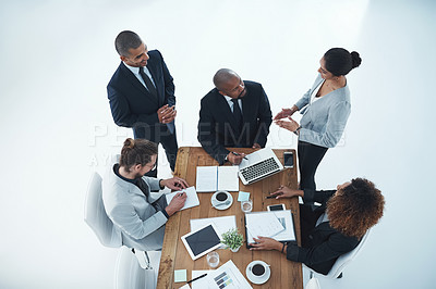 Buy stock photo High angle shot of a group of businesspeople having a meeting