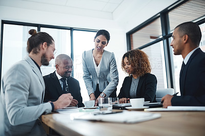 Buy stock photo Shot of a group of businesspeople having a discussion in a boardroom