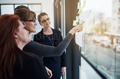 Buy stock photo Employees, sticky notes and plan on glass in office, brainstorming and finance staff for budget. Business people, graphs and vision for income growth, coworking and solution for expenses in meeting