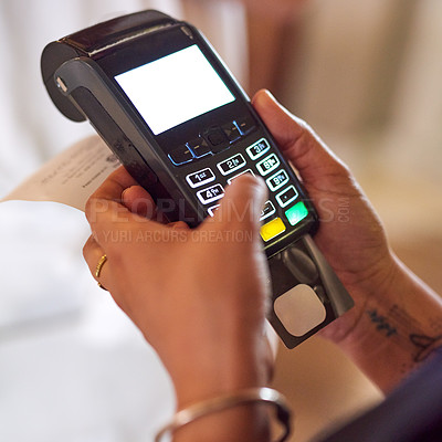 Buy stock photo Closeup shot of a woman using a payment terminal in a shop