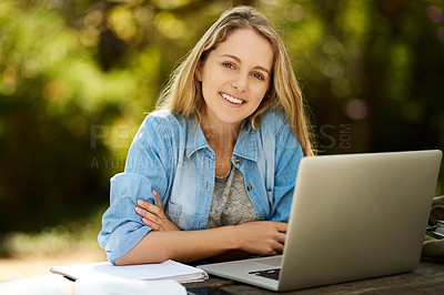 Buy stock photo Shot of a young woman studying outdoors