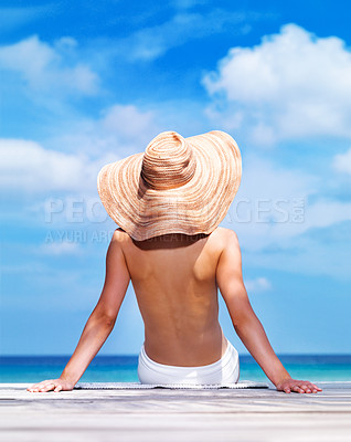 Buy stock photo A sun kissed woman relaxing on the beach in a bikini