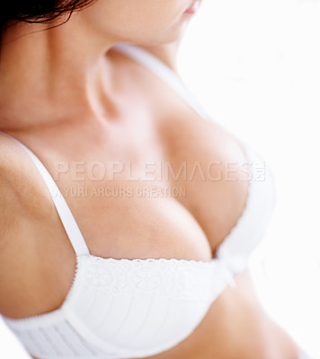 Buy stock photo Lingerie, body and boobs of a woman in a bra while in her bedroom for beauty, fashion and style. Sexy female underwear model in a house or hotel for desire, seduction and self love for art deco