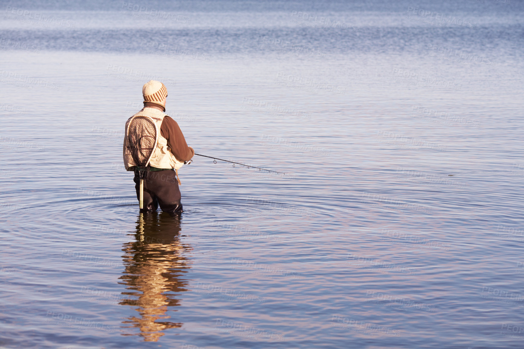 Buy stock photo Nature, relax and fishing with man in lake for summer break, hobby and peace on vacation. Sports, casting and rod with fisherman or person standing in fresh water pond or river during a holiday