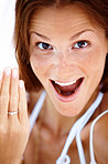 Excited young woman showing her engagement ring
