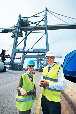 Buy stock photo Industry workers working on a shipping dock to export stock packages, boxes or containers. Portrait of industrial, business and shipment employees at a cargo logistics outdoor warehouse with a crane.