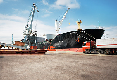 Buy stock photo A photo of a harbor with anchored ships and a stationary truck