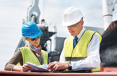 Buy stock photo Logistics worker, employee and people doing administration with document, planning construction at work and team working manufacturing industry. Man and woman reading paper and talking about project
