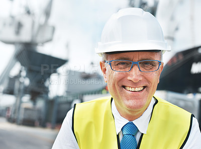 Buy stock photo Portrait of a dock worker standing at the harbor amidst shipping industry activity