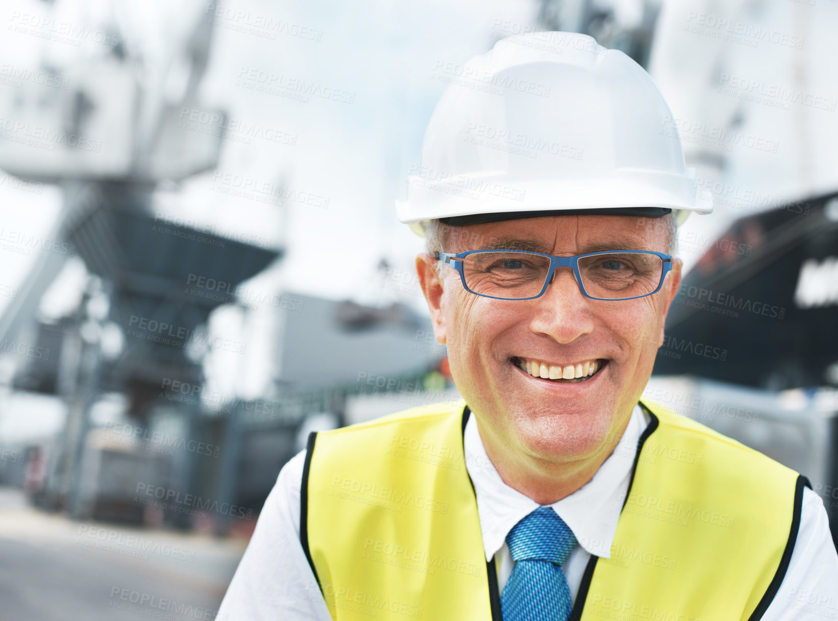 Buy stock photo Portrait of a dock worker standing at the harbor amidst shipping industry activity