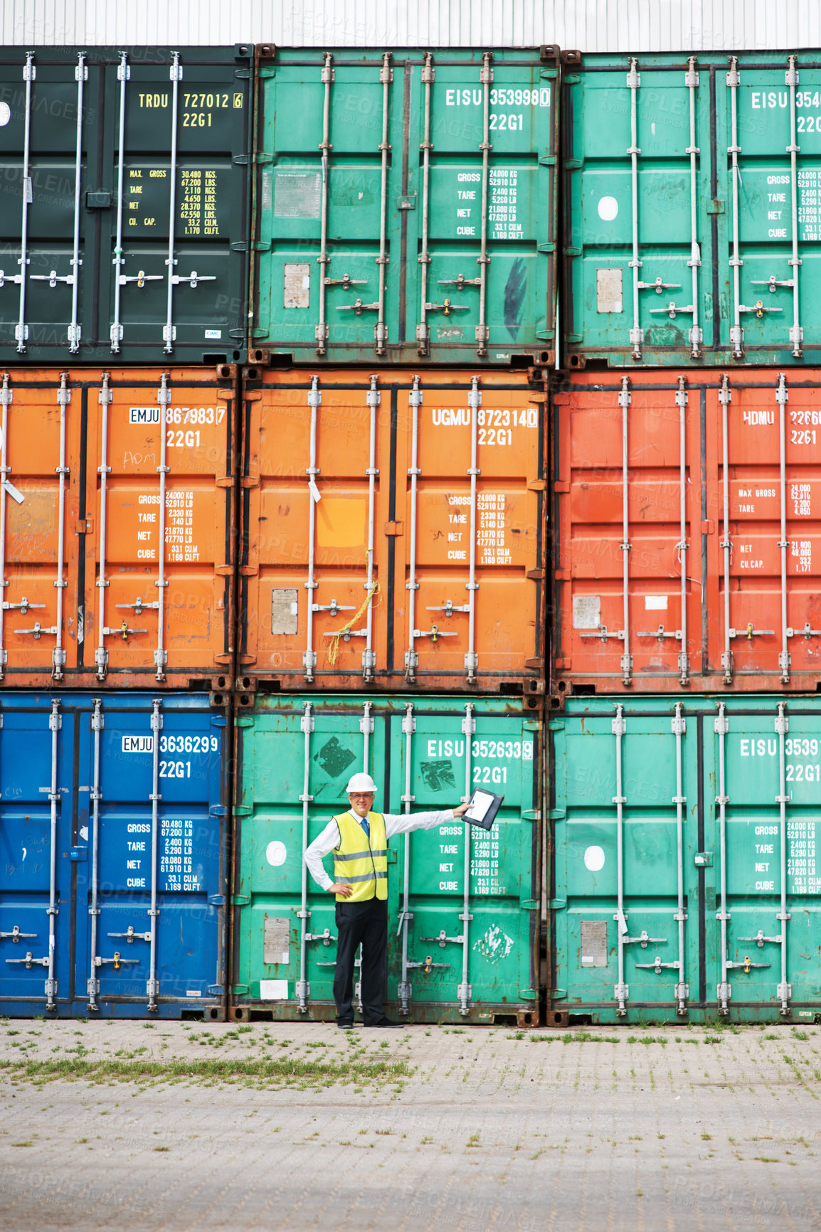 Buy stock photo Logistics worker in shipping or manager of container store at a port, working in safety at global sea freight transport business. Cargo ready for international delivery, export and commercial trade. 