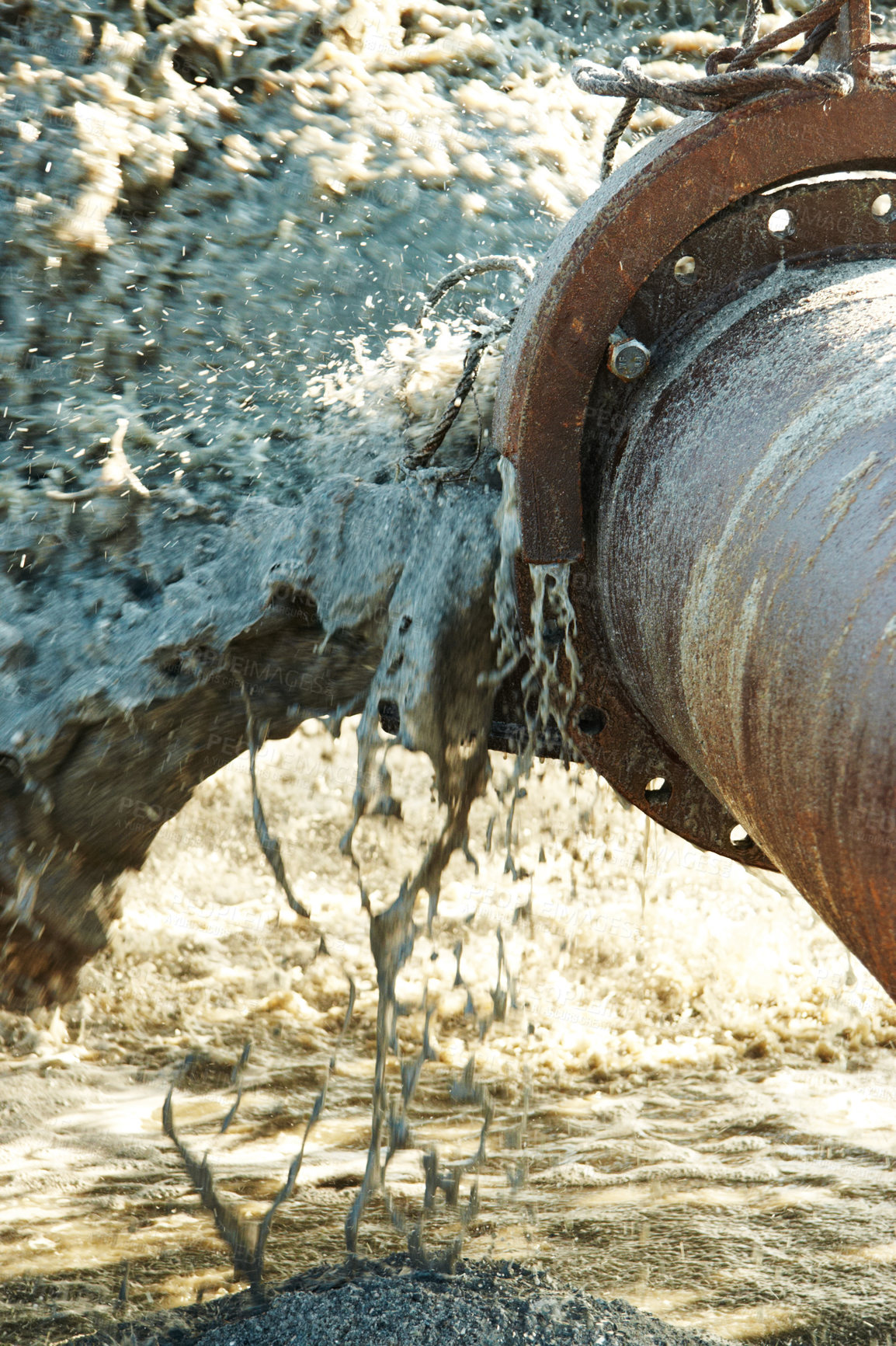 Buy stock photo Burst rusty pipe with polluted water gushing out. Closeup of a damaged and broken pipeline with dirty liquid coming out of it. Destroyed old metal drain causing floods wastage due to heavy leaks