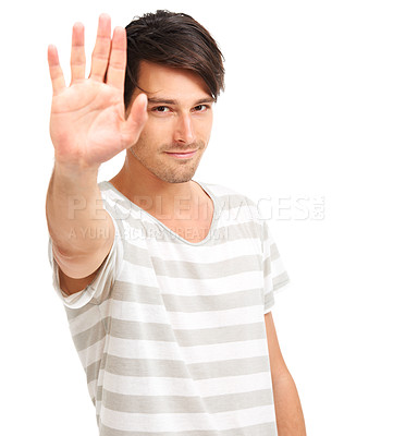 Buy stock photo Handsome trendy young man holding up his hand to the camera, isolated on white - copyspace