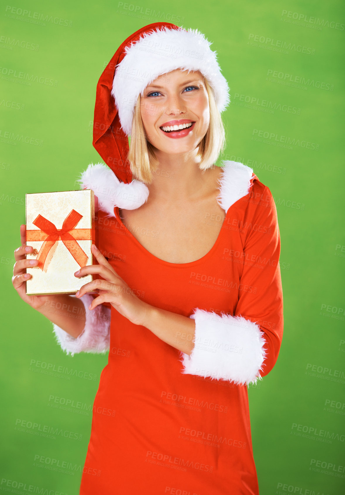 Buy stock photo Woman, Christmas and outfit holiday gift in studio for festive, season or smile. Female person, costume and portrait on green background or present box, excited celebration, winter break or vacation