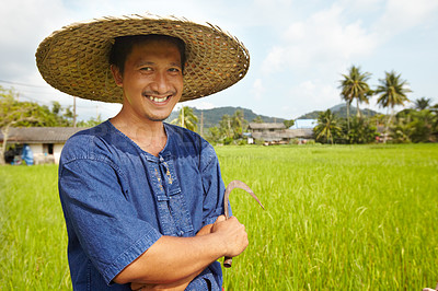 Buy stock photo Portrait of a rice farmer holding a traditional harvesting tool - Thailand