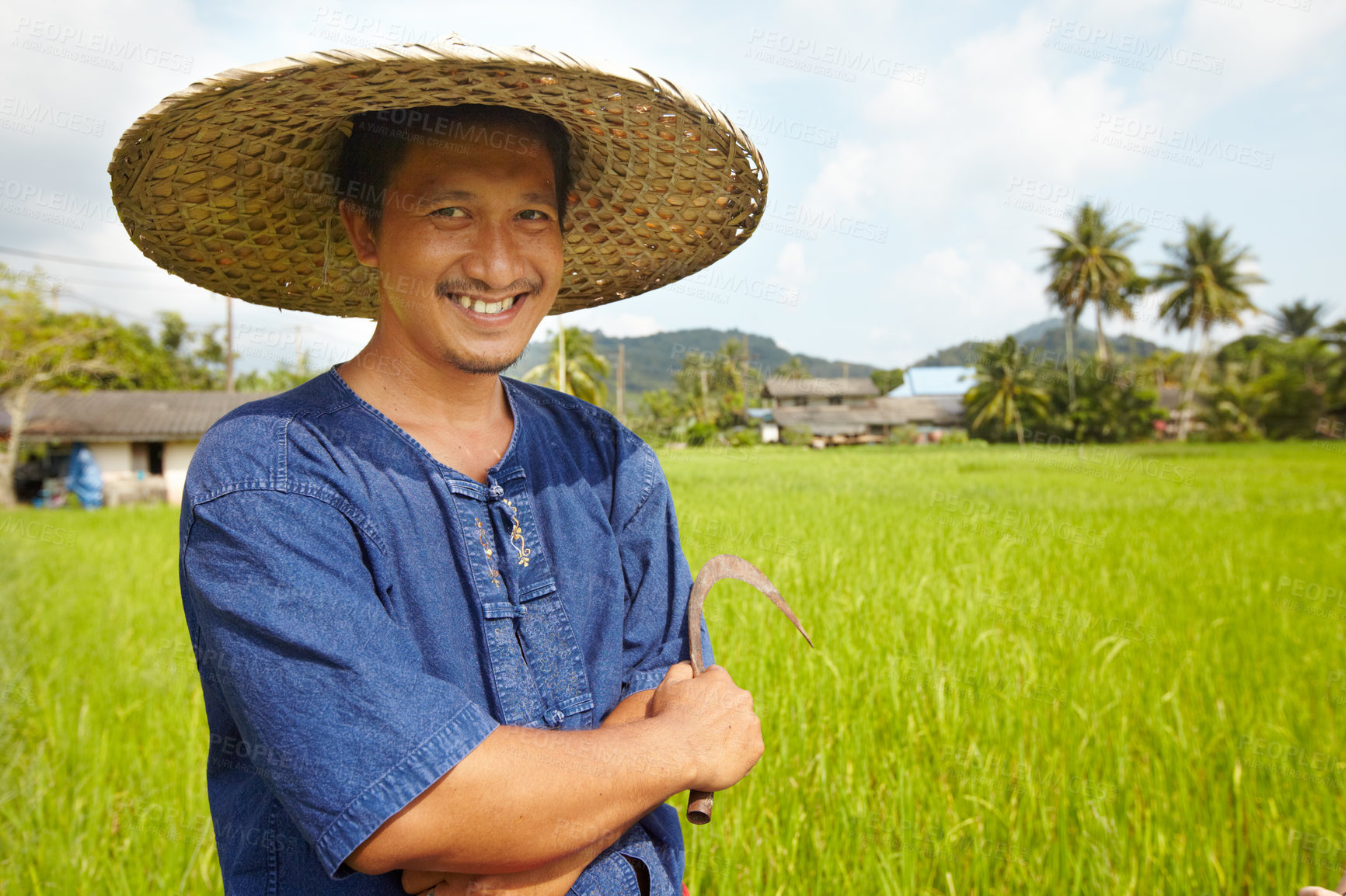 Buy stock photo Portrait of a rice farmer holding a traditional harvesting tool - Thailand