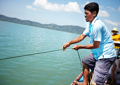 Buy stock photo Fisherman, boat and man with net at sea, lake or hunting in water in tropical summer. Fishing, rope and person at ocean on ship transport to catch food, pulling work or trawling in nature in Thailand