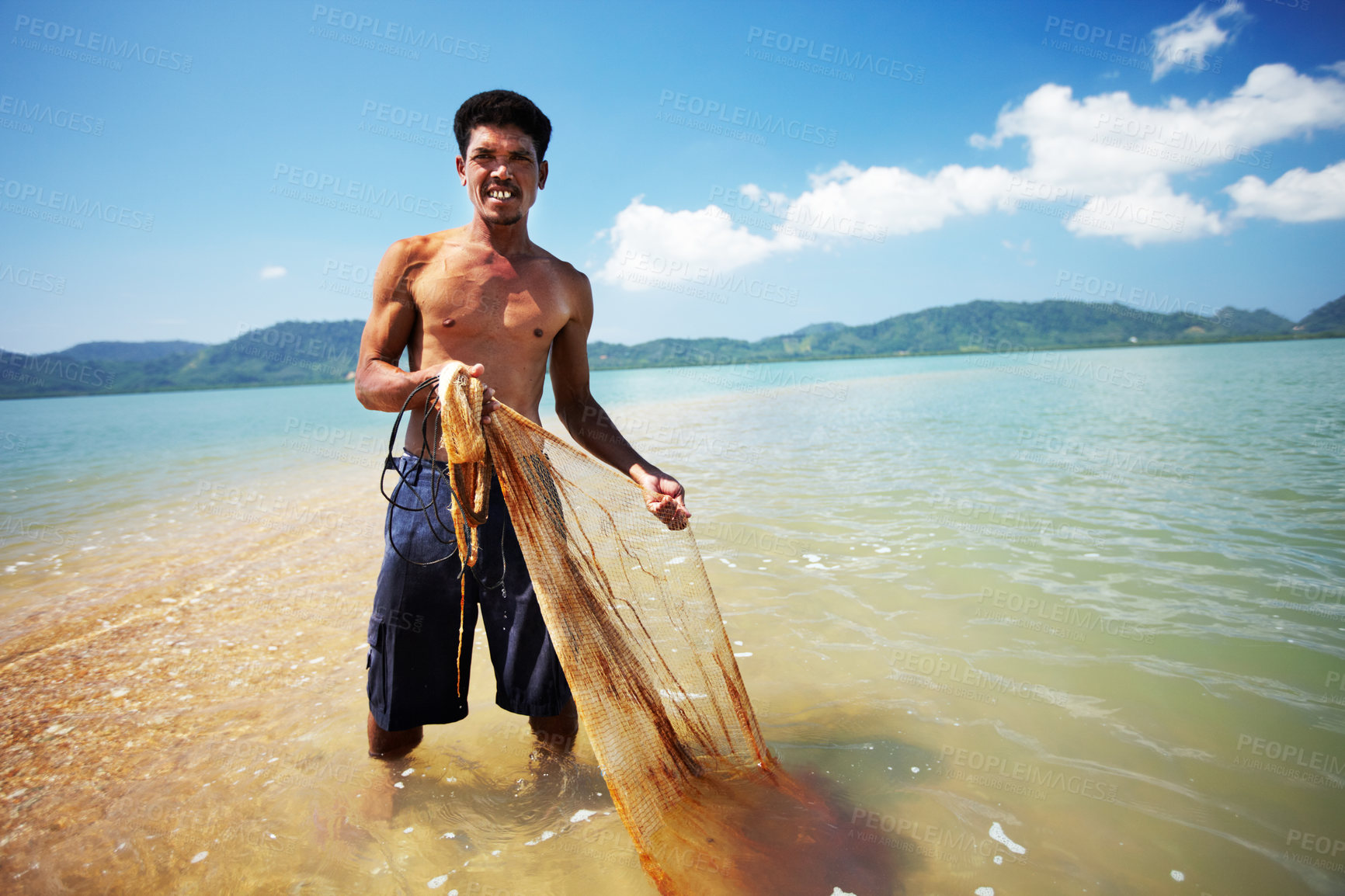 Buy stock photo Fisherman, ocean and man with net working, nature and labor with fishing in Thailand and tropical island. Sea, job and rope with worker in water to catch fish and beach with environment and portrait