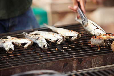 Buy stock photo Fish, food and girll at a street market in Thailand for nutrition or local delicacy during travel closeup. Cuisine, trade and seafood outdoor for purchase or experience of culture and tradition