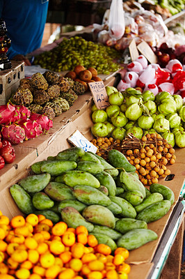 Buy stock photo Thailand, fruits and market for natural food, healthy groceries and local vendor with mango, guava and green stock. Seller, supplier or small business with product choice, tourism and sale at store