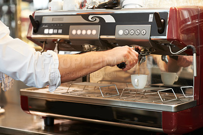 Buy stock photo Coffee machine, closeup and man barista in a cafe making latte, cappuccino or espresso in a cup. Equipment, mug and zoom of male waiter or small business owner working on an order in a restaurant.