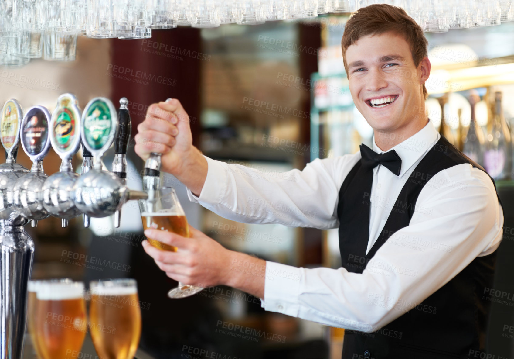 Buy stock photo Barman, happy and portrait with glass, beer or drink service for welcome, help or customer experience. Waiter, bartender or person with smile, container or alcohol at nightclub, pub or restaurant