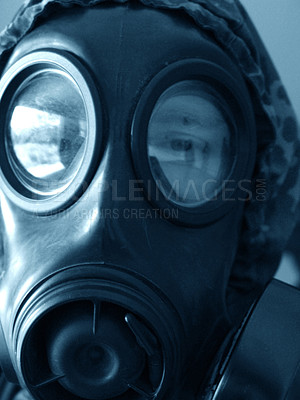 Buy stock photo Closeup shot of a man in a gasmask