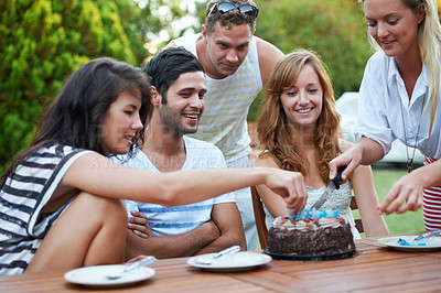 Buy stock photo Birthday, friends and cutting cake outdoor for celebration, surprise or party with milestone or happiness. Dessert, men and women in backyard of home with gathering or social event with smile and fun