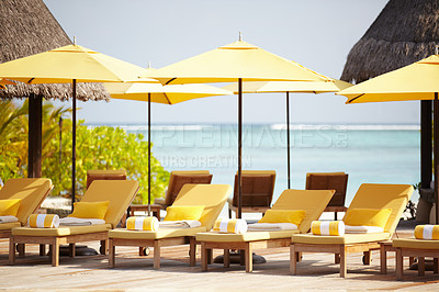 Buy stock photo Maldives, deck chairs and umbrella on beach for luxury, travel or summer villa for vacation or holiday. Tropical, leisure and ocean for resort, relax and island with sunshine, outdoor or caribbean 