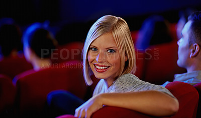 Buy stock photo Cinema, portrait and happy woman, watching film with smile on romantic date together. Movie night, face of girl in theater with man at box office show and sitting in auditorium to relax at premier.