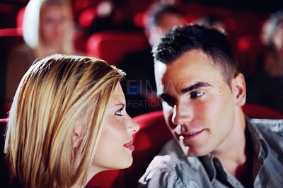 Buy stock photo Cinema, romance and couple watching film, love and romantic date together. Movie night, man and woman in theater with smile, attraction and sitting in auditorium to relax   at show with happiness.