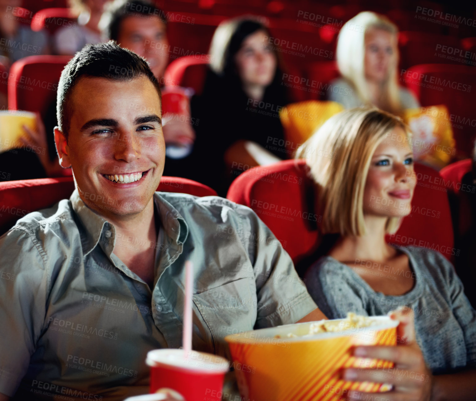 Buy stock photo Cinema, portrait and happy couple with popcorn, watching film and romantic date together. Movie night, man and woman in theater show with snacks, drink and smile in auditorium to relax in audience.