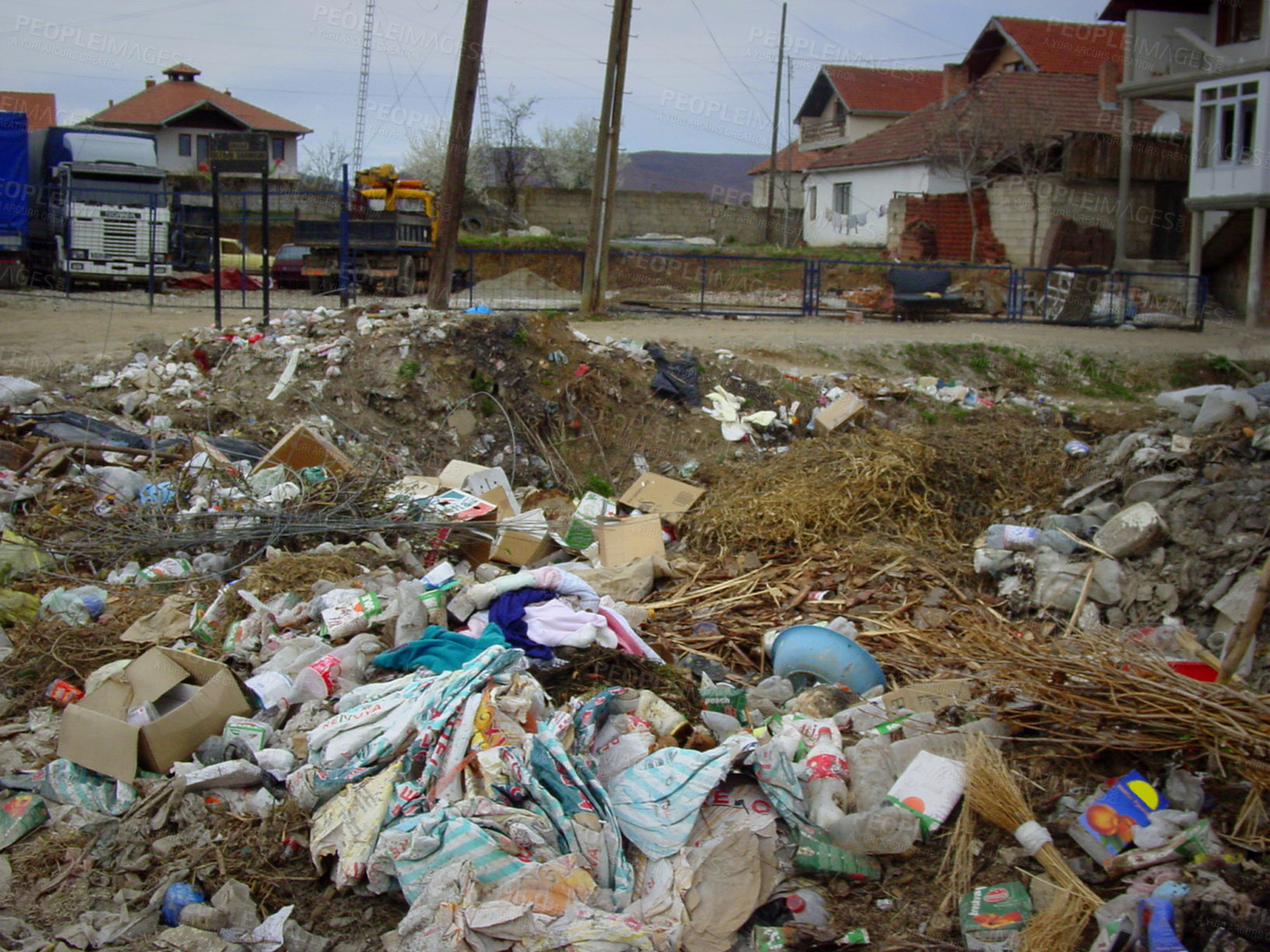 Buy stock photo Pollution, damage and abandoned village with trash, rubble and recycling for climate change crisis. Landfill, community and garbage, debris and social poverty with waste, dirt or ruins in countryside