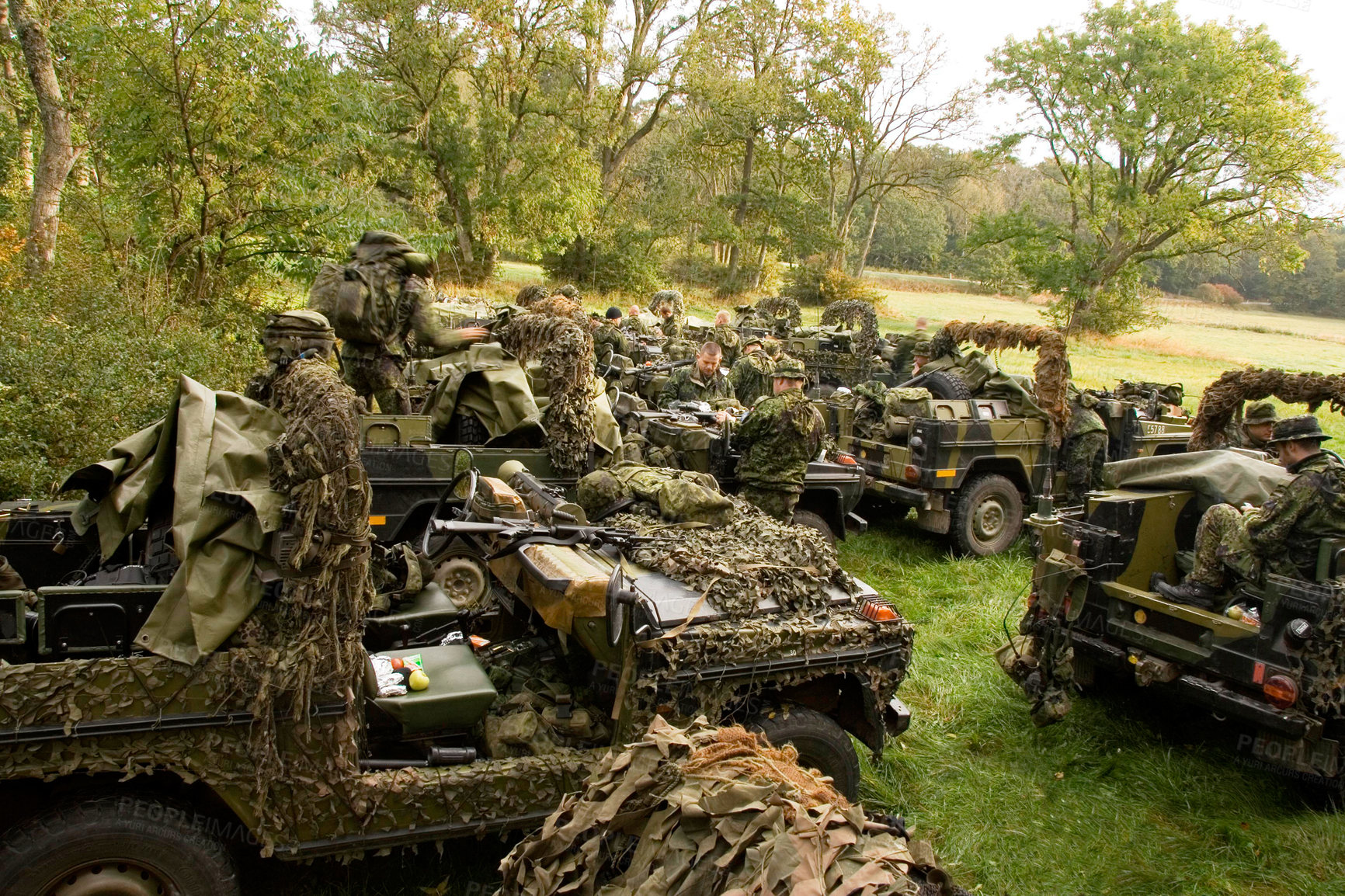 Buy stock photo Soldier, vehicle and military with people in the forest together, getting ready for an ambush during war on the battlefield. Army, training and camouflage with an infantry group on a field of grass 