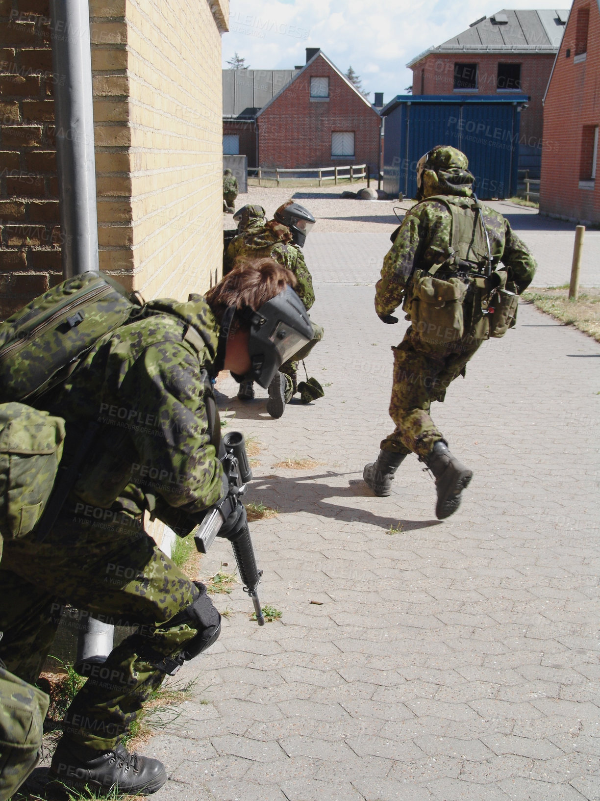 Buy stock photo Army, soldier and training by building with weapon for fitness, exercise or challenge outdoor with gear. Military, people and running for workout, mission or bootcamp with camouflage for survival