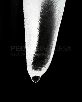 Buy stock photo Icicle crystal, black background and water dripping isolated on natural abstract texture. Ice, dark backdrop and closeup of melting, cold frozen snow or wet winter weather, frost on roof and ceiling