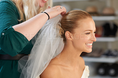 Buy stock photo A young bride getting her hair done before the wedding