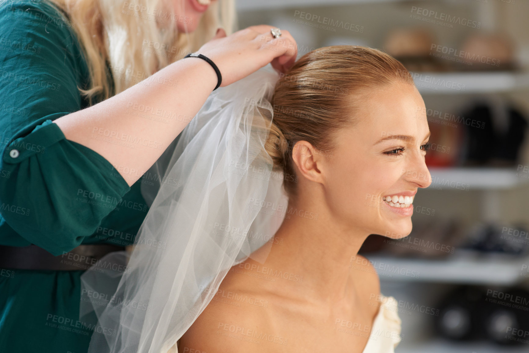 Buy stock photo A young bride getting her hair done before the wedding