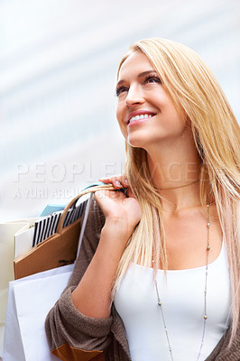 Buy stock photo Happy woman smile after retail shopping for fashion sale and holding bags in an urban city. Exploring different store and boutique in town and looking excited with clothing choice and purchase