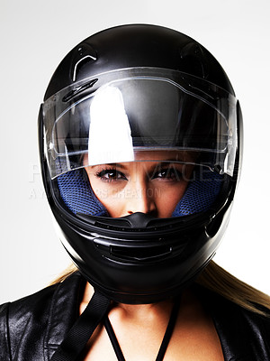 Buy stock photo Motorbike helmet, portrait and sexy woman in studio isolated on white background. Biker, face and safety of serious girl, sports protection and fashion style, motorcyclist racer and beauty of driver